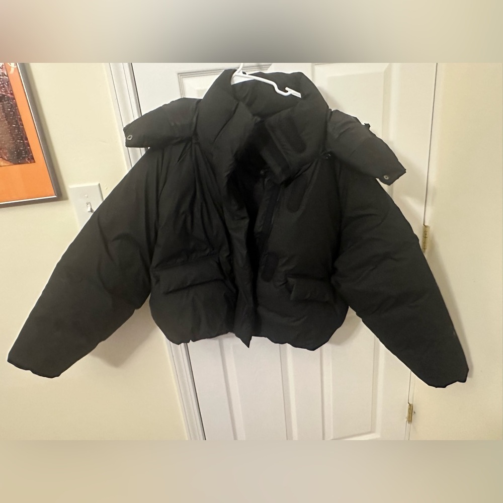 Kylie Jenner black puffer coat
